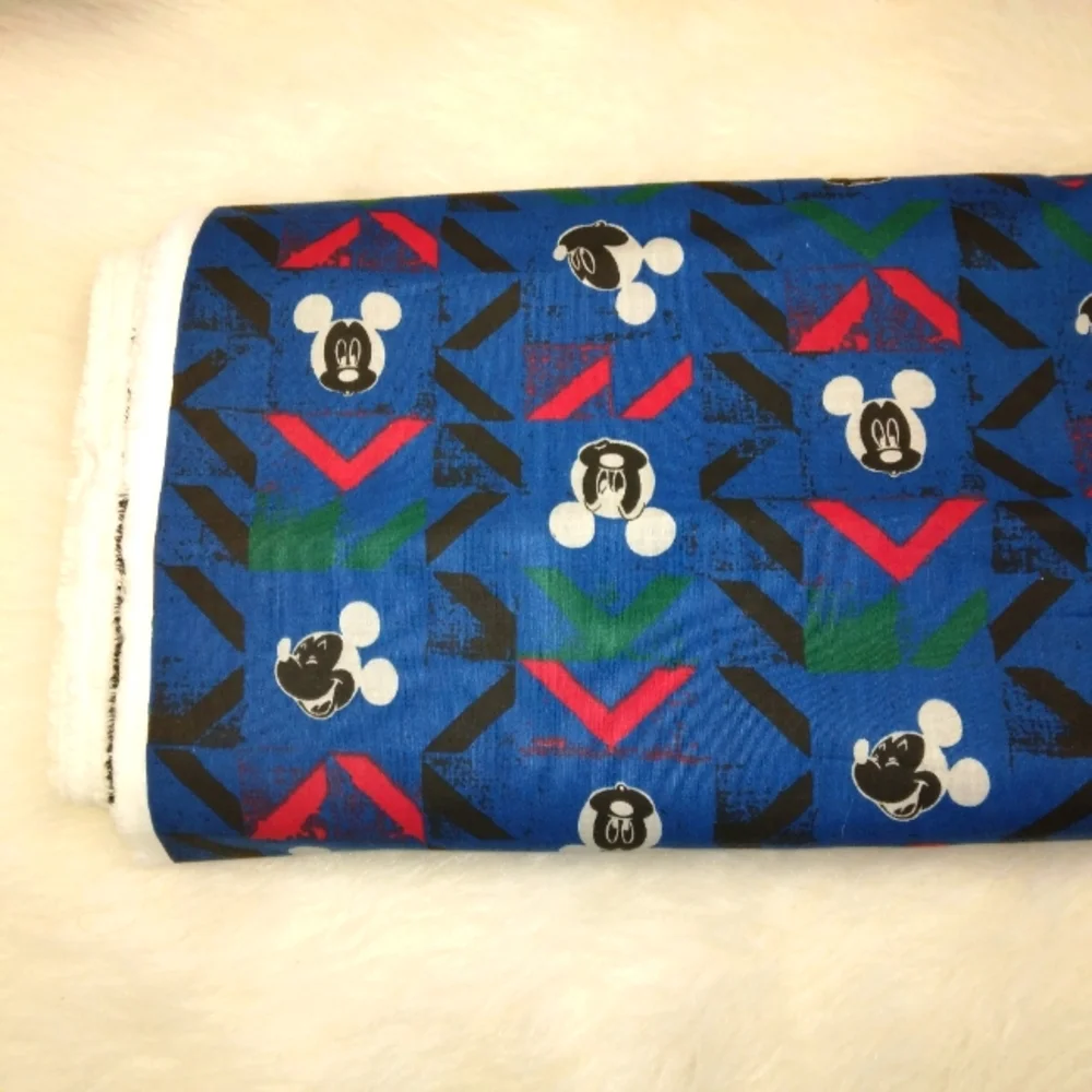 FABRIC Vintage Disney Mickey Mouse fabric on blue with abstract chevron,…